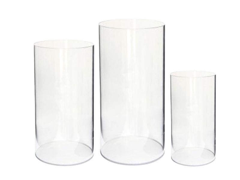 Three round clear acrylic plinths in different heights