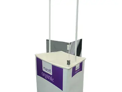 Macro Organic sampling counter with a purple header and two clear upright panels