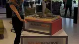 Perspex display case on a branded plinth for a scale model