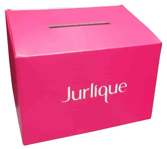 Vivid pink Jurlique corflute box with a white logo and a slot in the lid