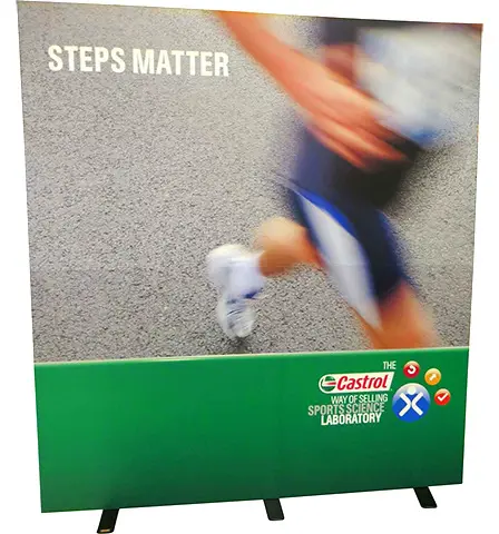 Castrol Steps Matter fabric wall with a runner photo above a green logo strip
