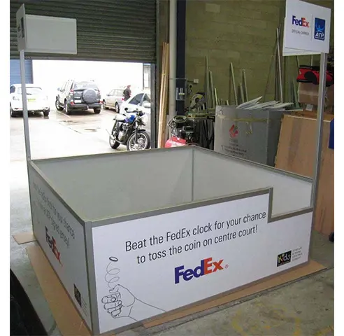 FedEx tennis game enclosure with beat-the-clock side panels and FedEx and ATP header signs