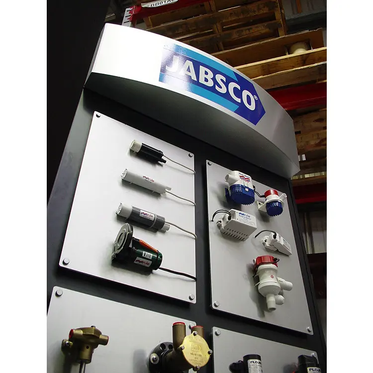 Jabsco tower with bilge pumps, switches and fittings on aluminium panels below a curved header