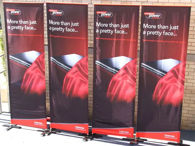 Four Toshiba laptop banners on cross-shaped feet reading More than just a pretty face