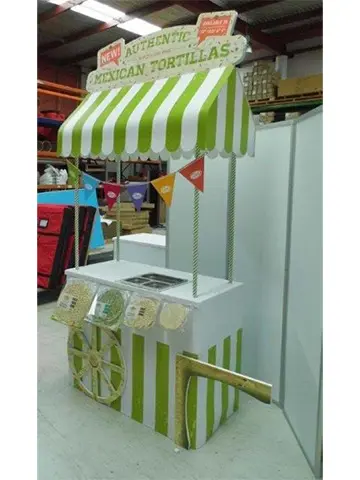Authentic Mexican Tortillas cart with a green and white striped awning and bunting