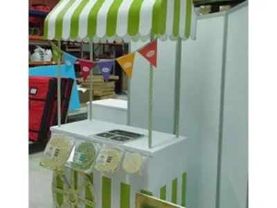 Authentic Mexican Tortillas cart with a green and white striped awning and bunting