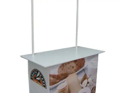 Cheese sampling table with a header board showing South Cape and Tasmanian Heritage logos