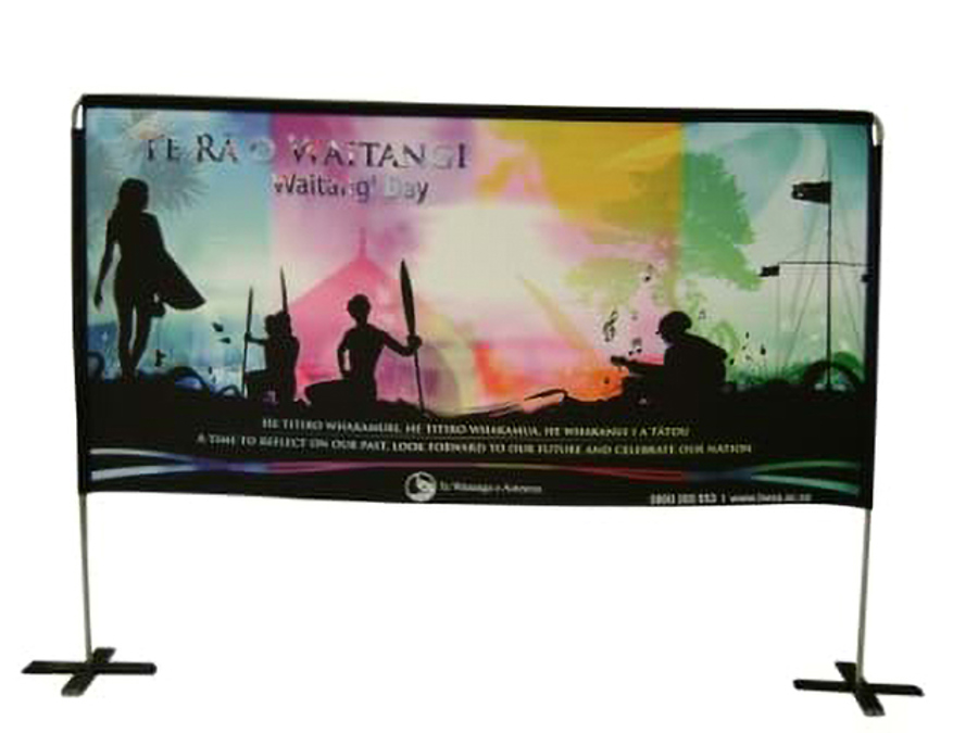 Printed event banner with colourful silhouettes, stretched between two poles on cross-shaped feet