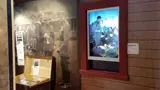 Portrait digital screen in a museum window frame