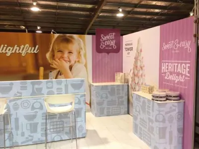 Sweet & Easy Heritage Delight stand with kitchen-icon counters, wall prints and high stools