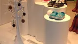 Cylinder display pedestals in a shoe store window
