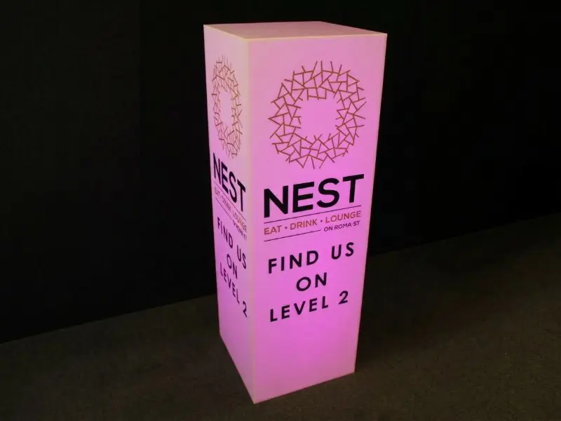 A frosted plinth with opaque cut vinyl lettering