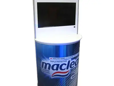 Macleans curved counter with a printed wrap and a built-in TV screen panel