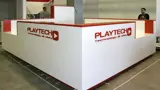 Custom built display booth with red-trimmed walls