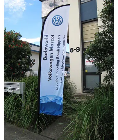 Barloworld Volkswagen Mascot flag supporting Bondi Nippers beside an entrance