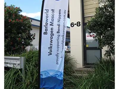Barloworld Volkswagen Mascot flag supporting Bondi Nippers beside an entrance