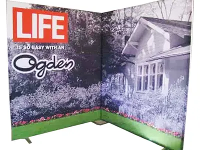 Ogden corner backdrop with a cottage garden image and a lawn strip with flowers