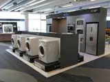 Product display with appliance plinths and kitchen wall