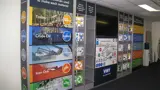 Modular exhibition walls with sample shelves and screen