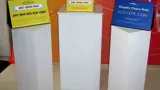Voting station with white plinths and angled signs
