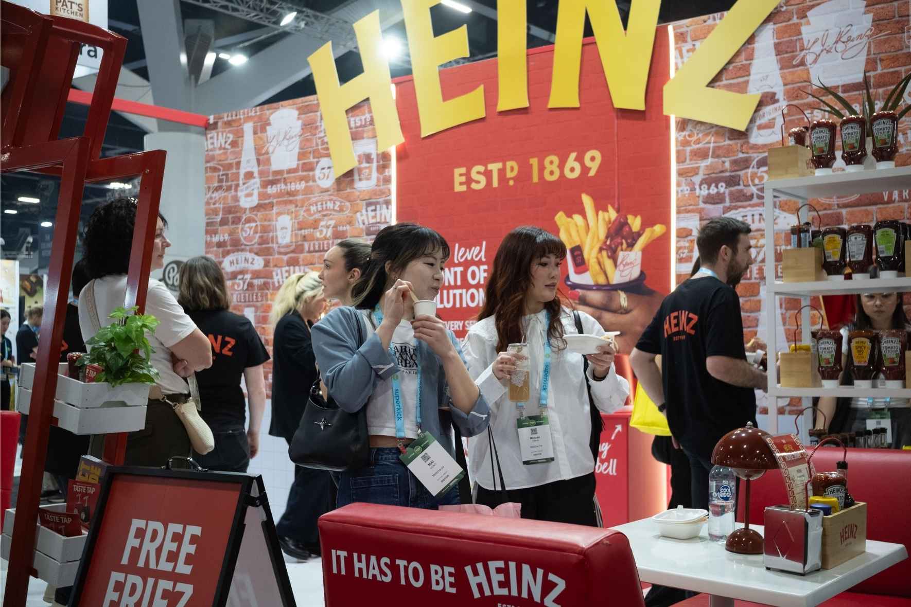 Heinz exhibition stand with visitors sampling product