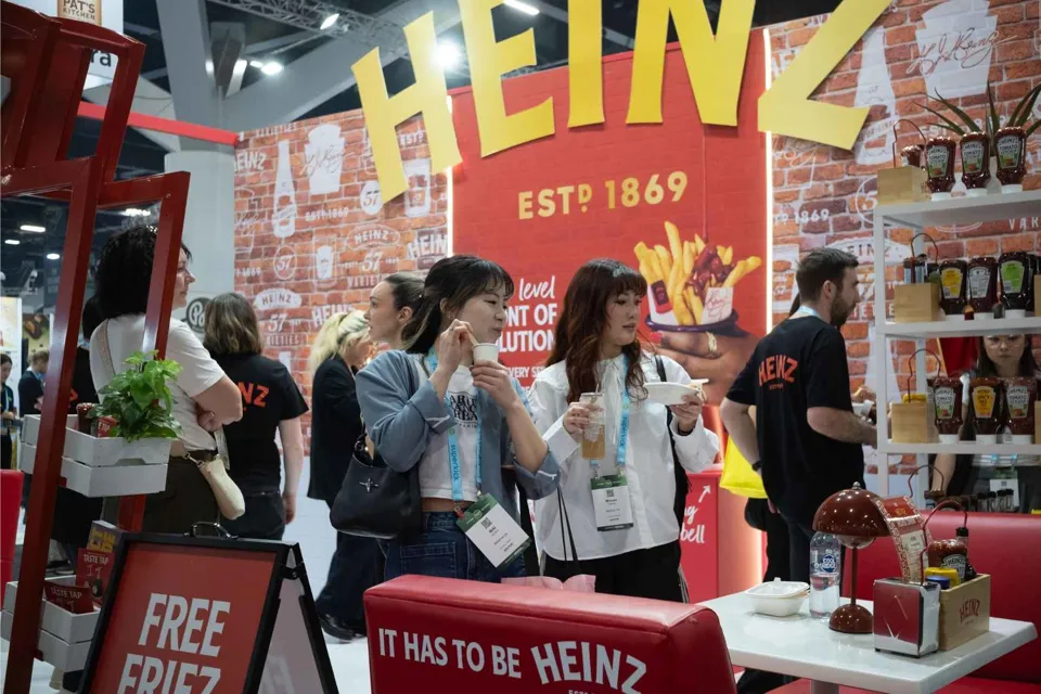 Heinz exhibition stand with visitors sampling product