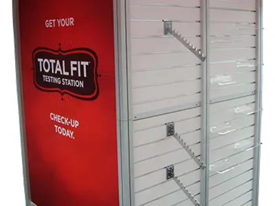 Total Fit Testing Station cube with a red graphic side and slatwall waterfall arms