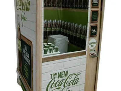 Coca-Cola Life kiosk with a striped awning, white brick-look walls and bottles behind a window