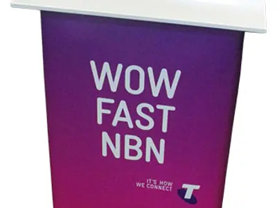 Telstra Wow Fast NBN table with a purple front and large white lettering