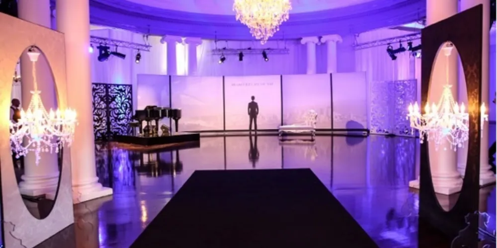 Fifty Shades of Grey premiere room with runway, chandeliers and purple lighting
