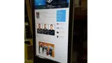 Digital signage kiosk showing a full web page