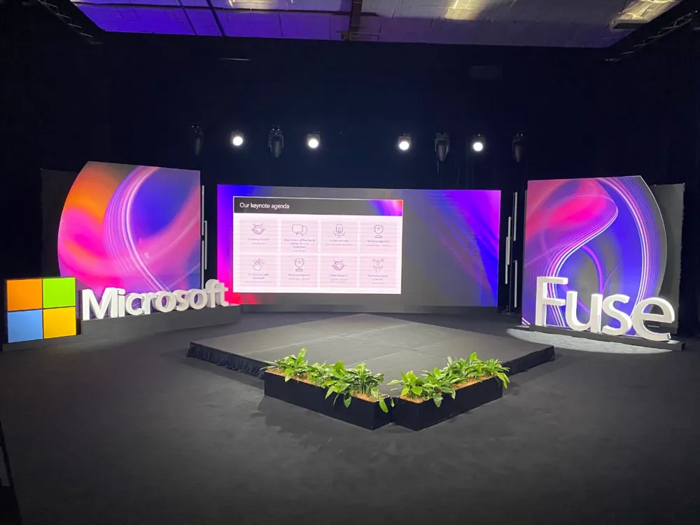 Microsoft Fuse keynote set with 3D logo, curved LED screens and a planted stage edge