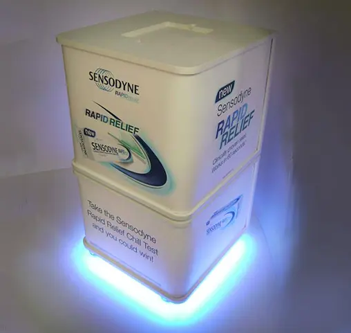 Sensodyne Rapid Relief cube with large pack graphics and a glowing LED base