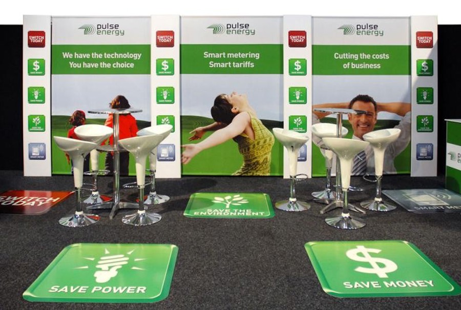 Exhibition stand with matching Pulse Energy wall graphics, printed floor decals and white bar stools