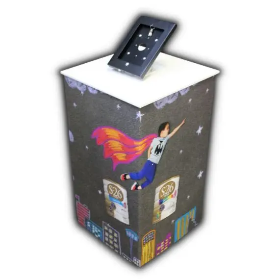 S-26 tablet pedestal wrapped in a night-sky illustration of a flying child and tins