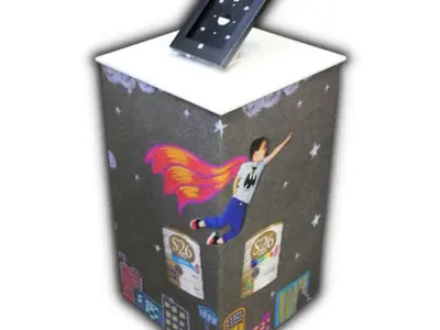S-26 tablet pedestal wrapped in a night-sky illustration of a flying child and tins