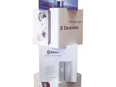 Electrolux and Simpson appliance cubes stacked at angles under a tall graphic panel