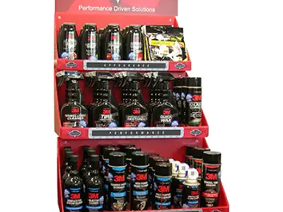 3M Car Care unit with a large header above angled red trays of bottles