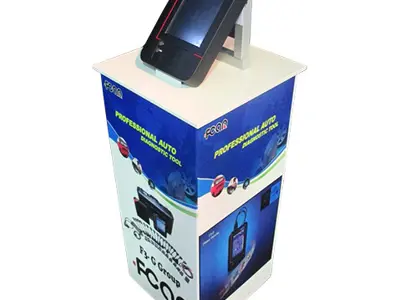FCAR plinth topped with a diagnostic tool, with product graphics on every side