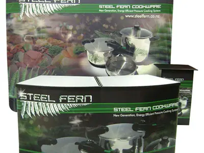 Steel Fern Cookware curved backdrop, counter and podium printed with pressure cooker images