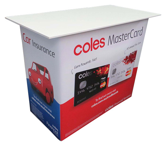 Coles counter with a MasterCard offer on the front and Car Insurance on the side