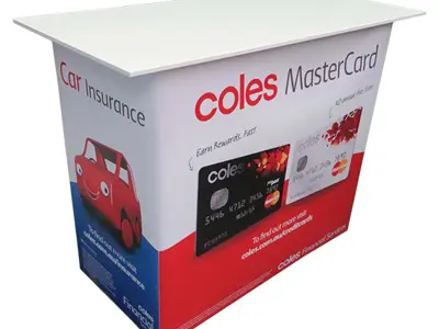 Coles counter with a MasterCard offer on the front and Car Insurance on the side