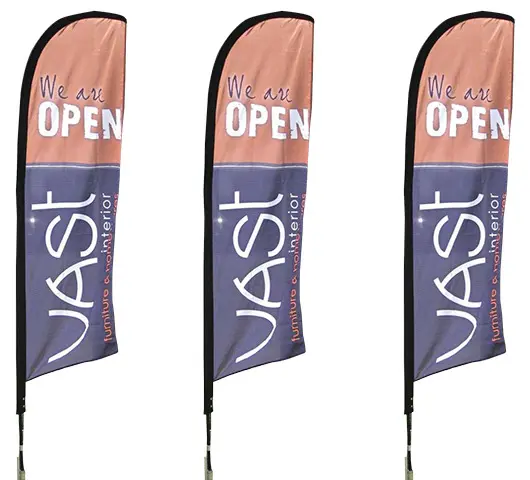 Row of tall VAST Interior feather flags announcing OPEN outside a furniture store