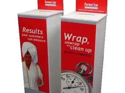 Two FormoStar stands with red headers and full-length wraps, one inviting demo registrations