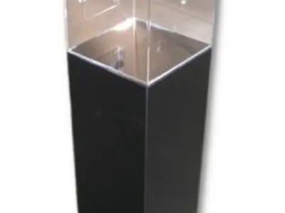 Clear acrylic case on a black plinth, with entry forms visible and a lockable door