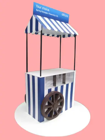 Citibank cart with a blue and white striped awning, Spring Packages header and timber-look wheel